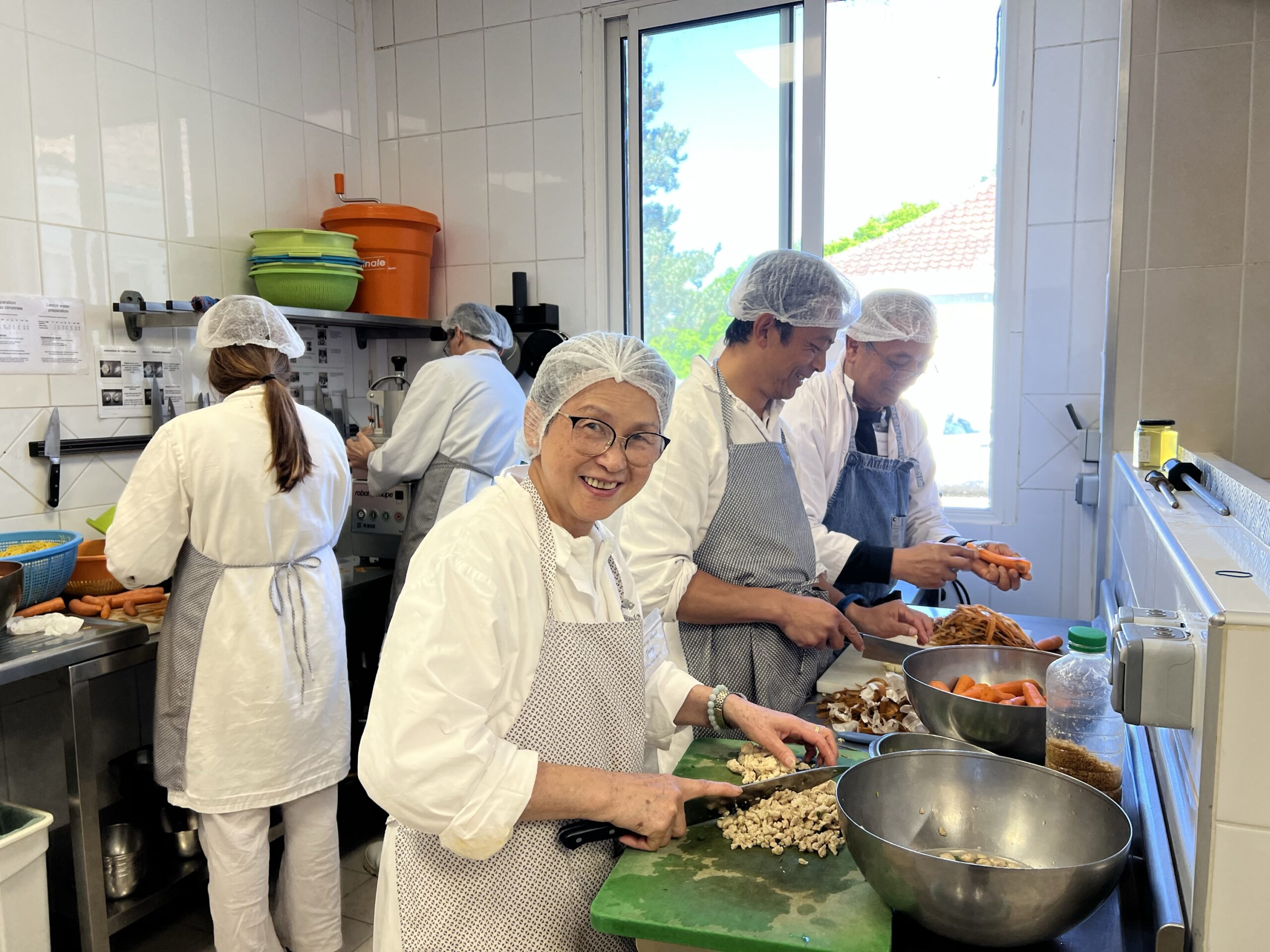 Old students preparing meals in the kitchen